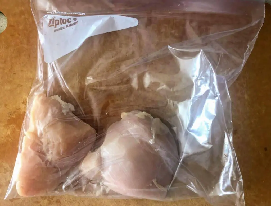 chicken breast in plastic bag