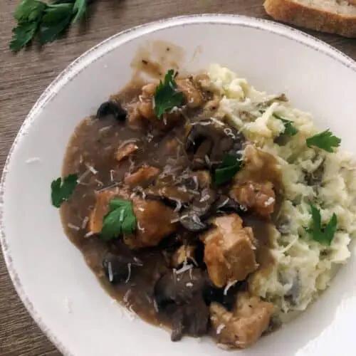 absolute best chicken marsala with mashed potatoes in a bowl