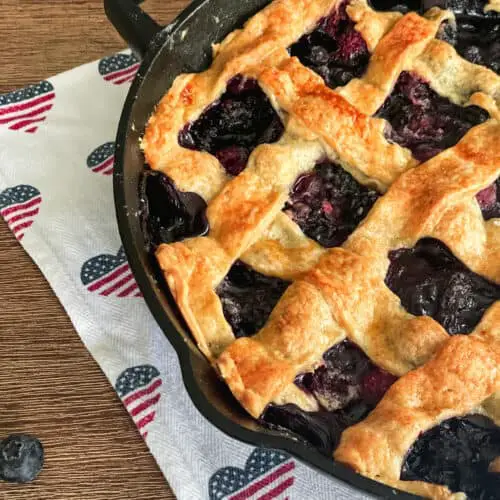 mixed berries in a cast iron cobbler